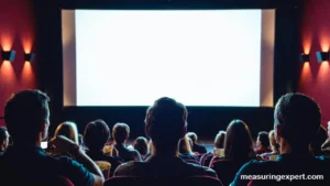 Theater audience waiting through movie previews before the film